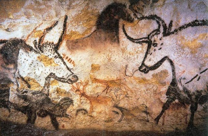 Painting of bulls, elk, and horses on stone